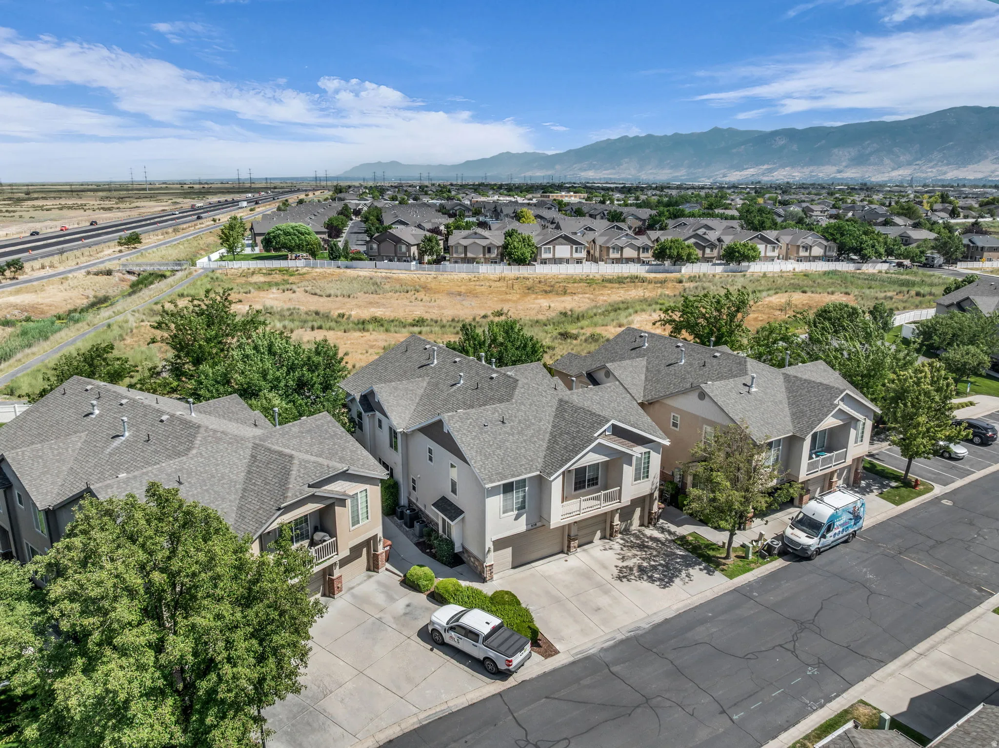 Residential community featuring multi-story properties with attached garages