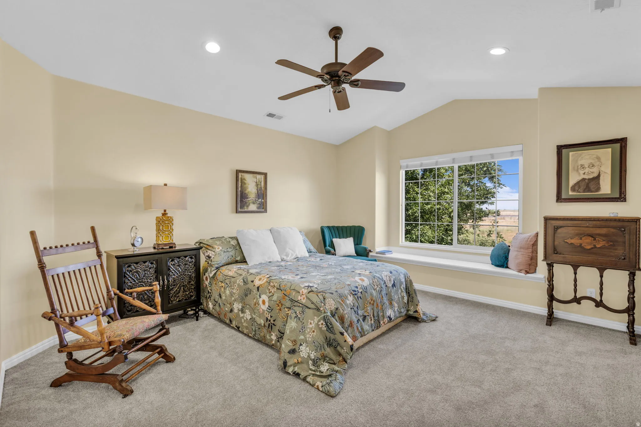 Vaulted ceilings featuring recessed lighting and a ceiling fan