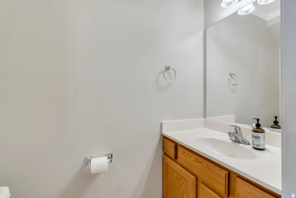 Bathroom vanity with a white countertop and a chrome faucet