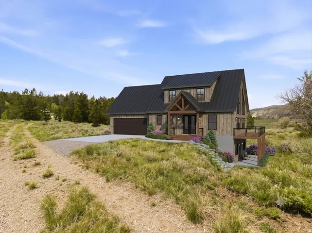 Contemporary rustic residence featuring a dark metal roof, wood-finish siding, and a prominent gable entry