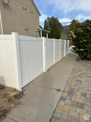 White privacy fencing with multiple gate access points
