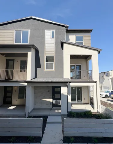 Modern multi-level exterior with a mix of stucco and siding finishes