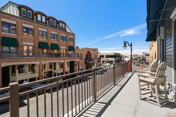 Exterior balcony featuring a metal railing system