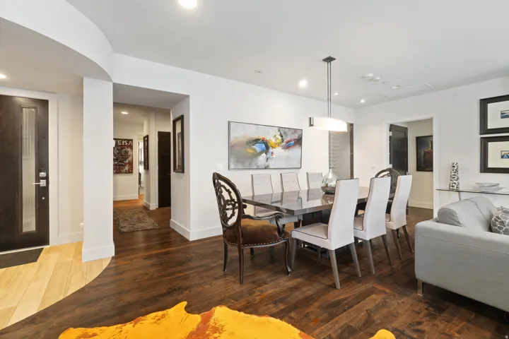 Dining area featuring recessed lighting and a contemporary chandelier