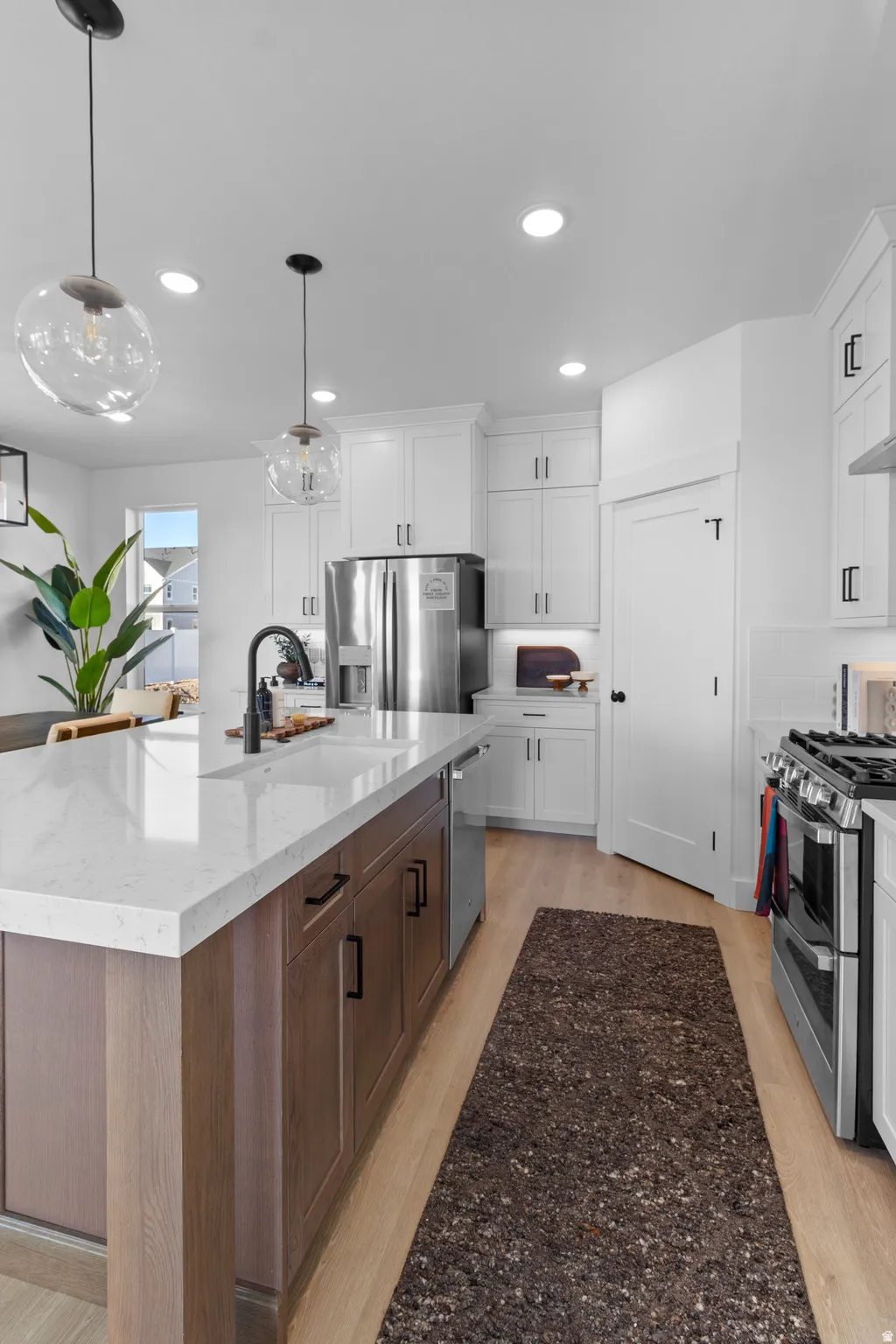Spacious kitchen featuring a large island (PICTURE IS FROM A PREVIOUS HOME...COLORS AND FINISHES MAY BE DIFFERENT)