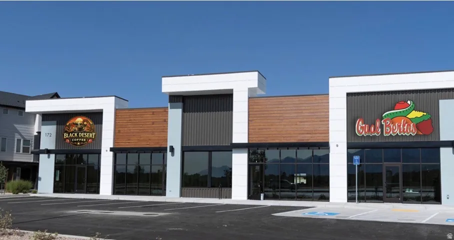 Modern commercial building featuring multiple storefronts