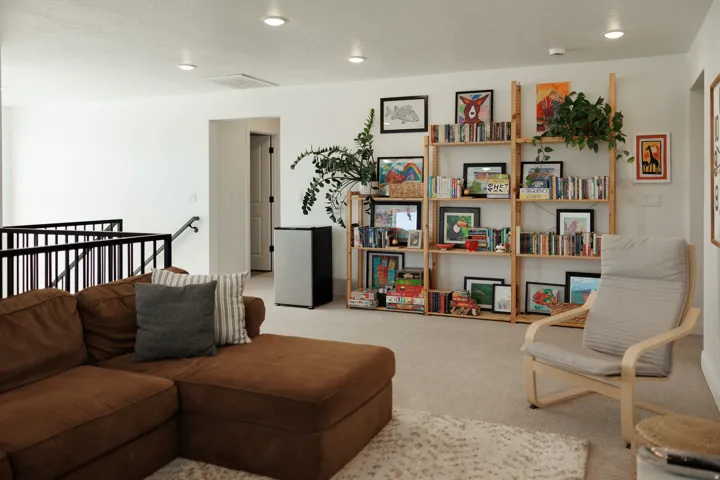 Carpeted recreation area with recessed lighting