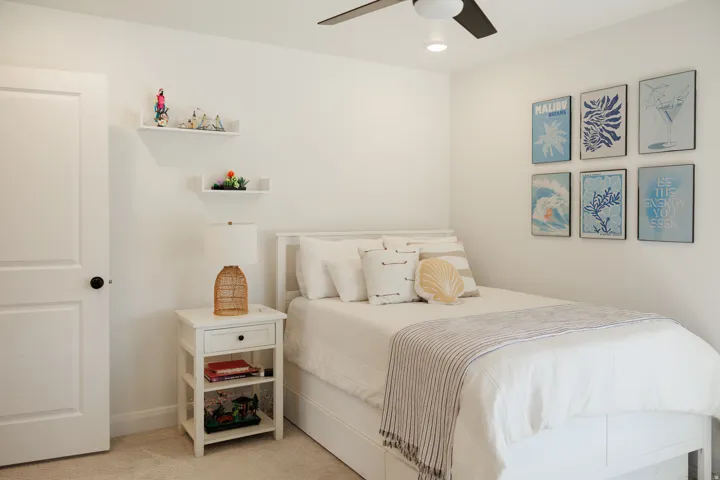 Bedroom featuring white walls and neutral carpeting
