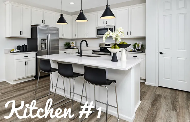 Well-appointed kitchen featuring white cabinetry, stainless steel appliances, a center island with countertop seating, and wood-finish flooring