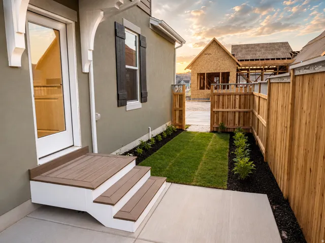 Private fenced yard with concrete patio