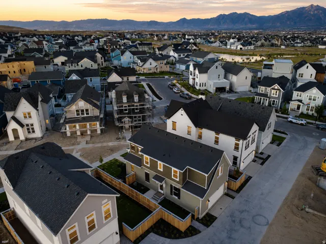 Newly constructed residential community featuring a variety of architectural styles, paved streets, and private fenced yards