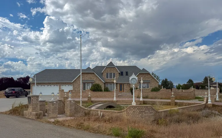 Brick exterior residence featuring an integrated two-car garage