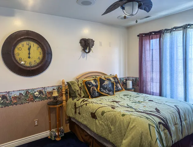 Recessed ceiling lighting, ceiling fan fixture, and window with sheer curtains