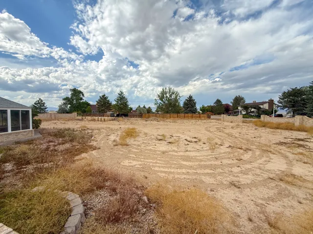 Spacious undeveloped lot featuring a substantial building area and established perimeter fencing