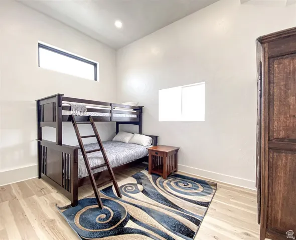 High ceilings featuring recessed lighting and two distinct windows