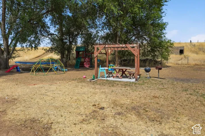 Expansive outdoor area featuring mature trees providing shade