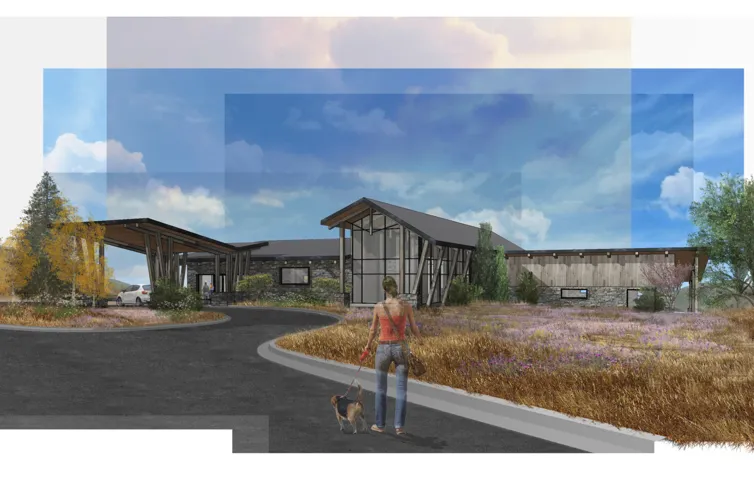 Modern architectural design featuring expansive glass panels, a stone and wood facade, and a covered entry with exposed structural beams
