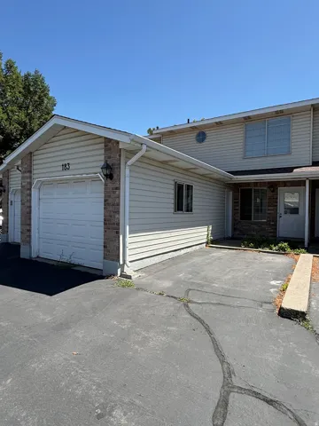 Siding and brick exterior with attached garage