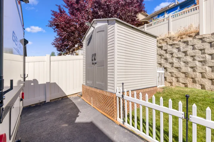 Exterior storage shed with double doors and lattice foundation skirting
