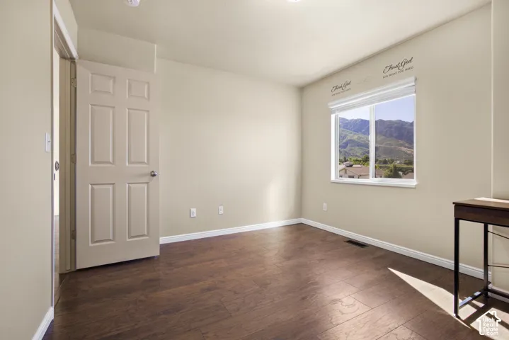 Neutral tone walls with wood-finish flooring