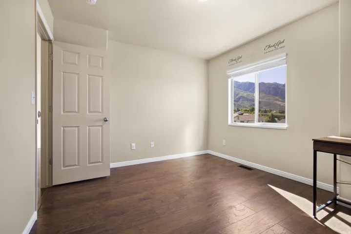 Neutral tone walls with wood-finish flooring