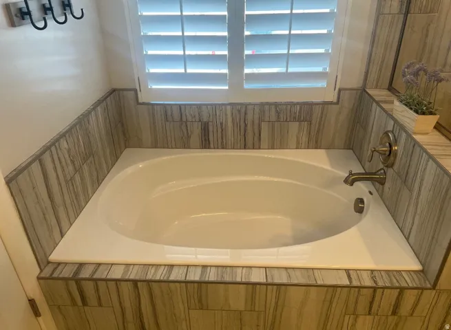 Built-in soaking tub featuring a bronze-finish faucet