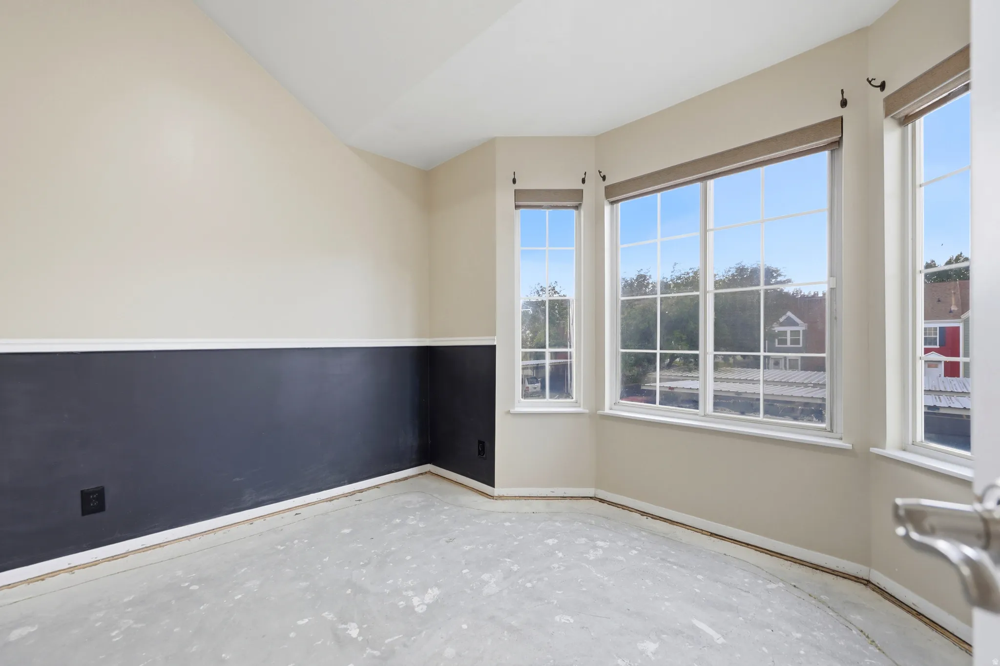 Bedroom number one. It has high ceilings and an interesting shelf space built in on top of the closet.