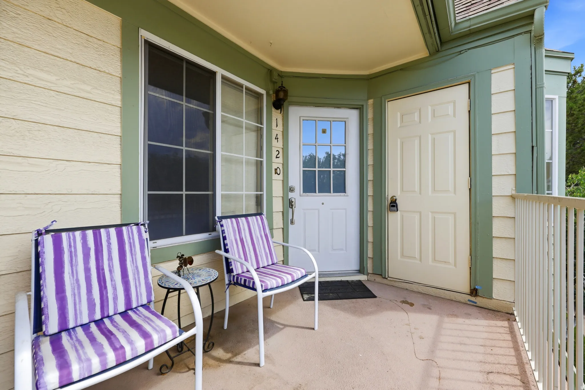 Covered outdoor patio area and storage closet. We're to the right at the top!