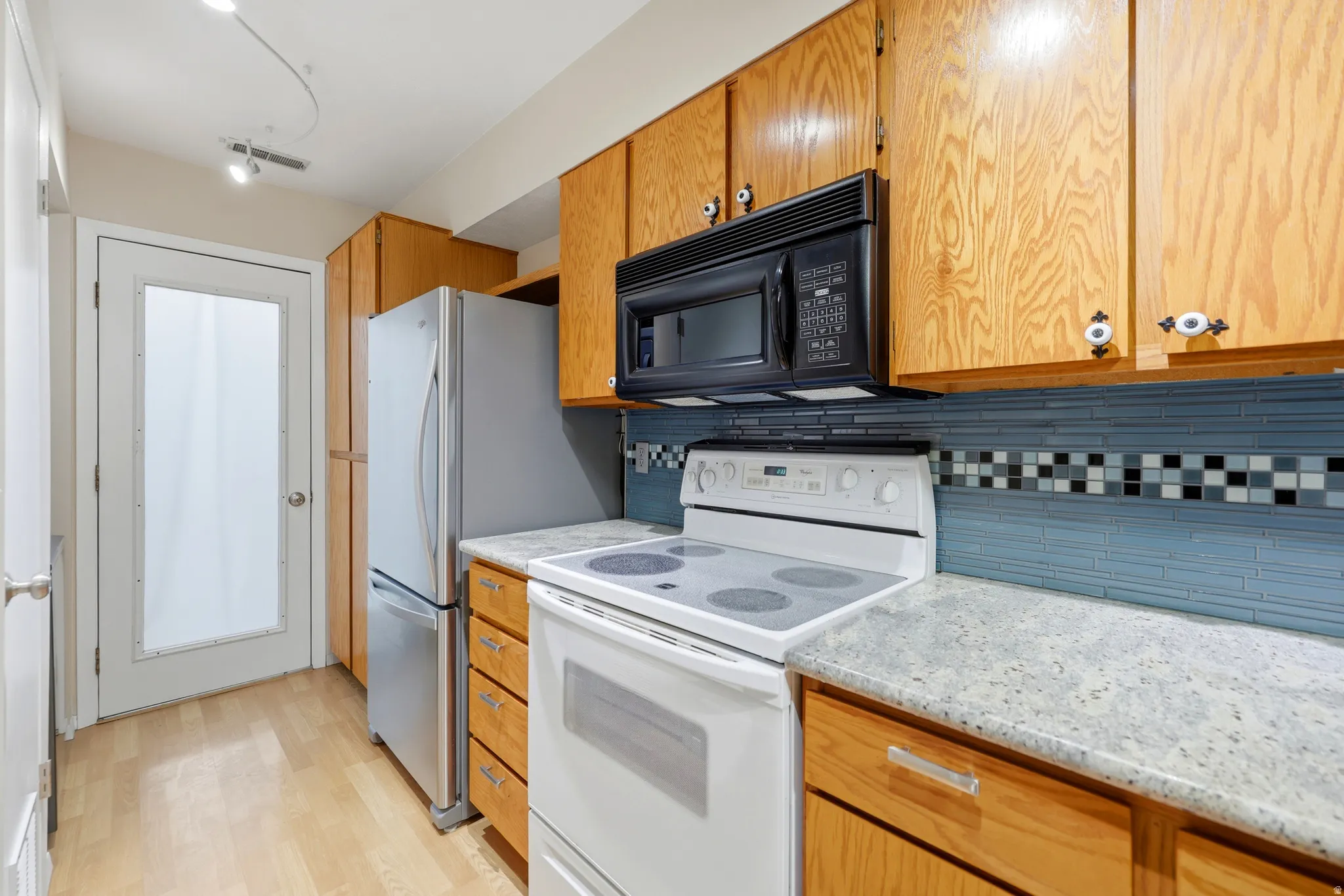 Cabinets are in great condition, and all appliances are in place for you!