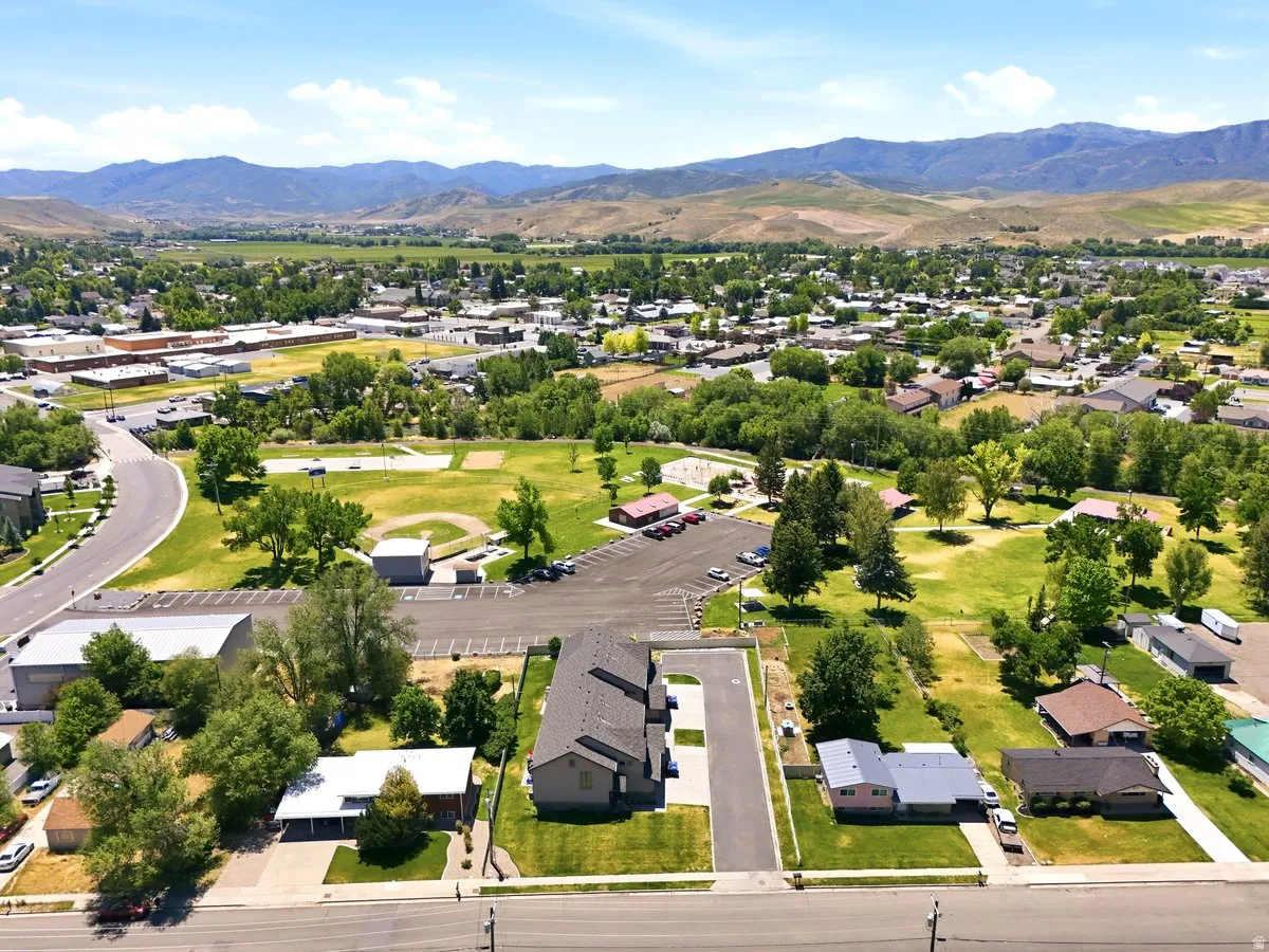 Aerial perspective showcasing the surrounding community with distant mountain ranges