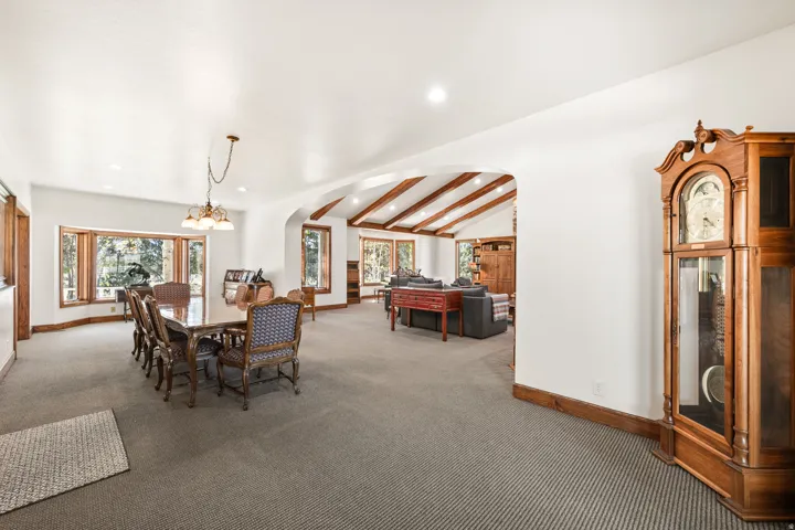 Spacious interior with neutral carpeting and white walls
