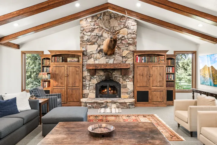 Vaulted ceiling featuring exposed wood beams