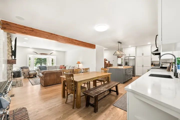 Open-concept living area featuring light wood-finish flooring throughout