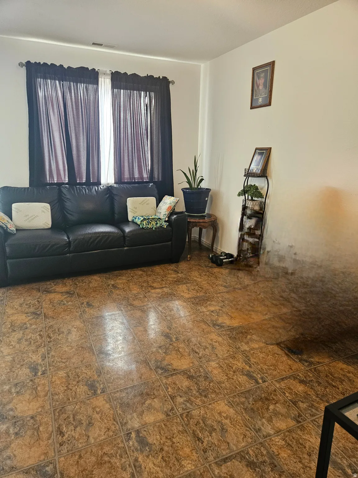 Textured tile flooring in a warm brown and beige palette