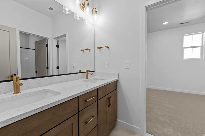 Jack and Jill Bathroom. Picture of another home with the same floorplan. Design selections may differ.