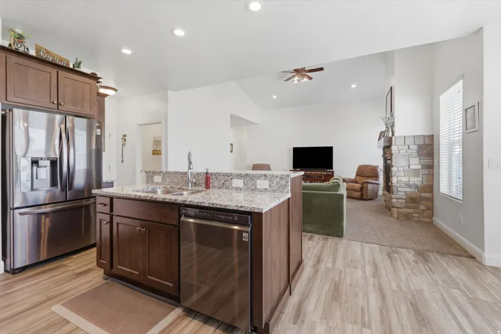 Kitchen featuring wood-finish flooring and an island