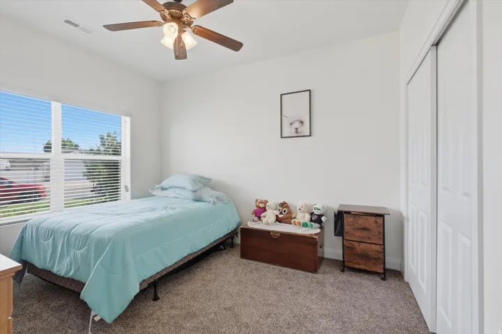 Bedroom 2 featuring a large window