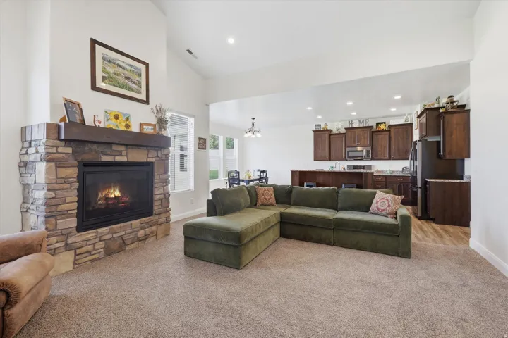 Stone fireplace with a wood mantel