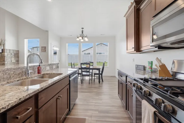 Kitchen featuring granite countertops, stainless steel appliances