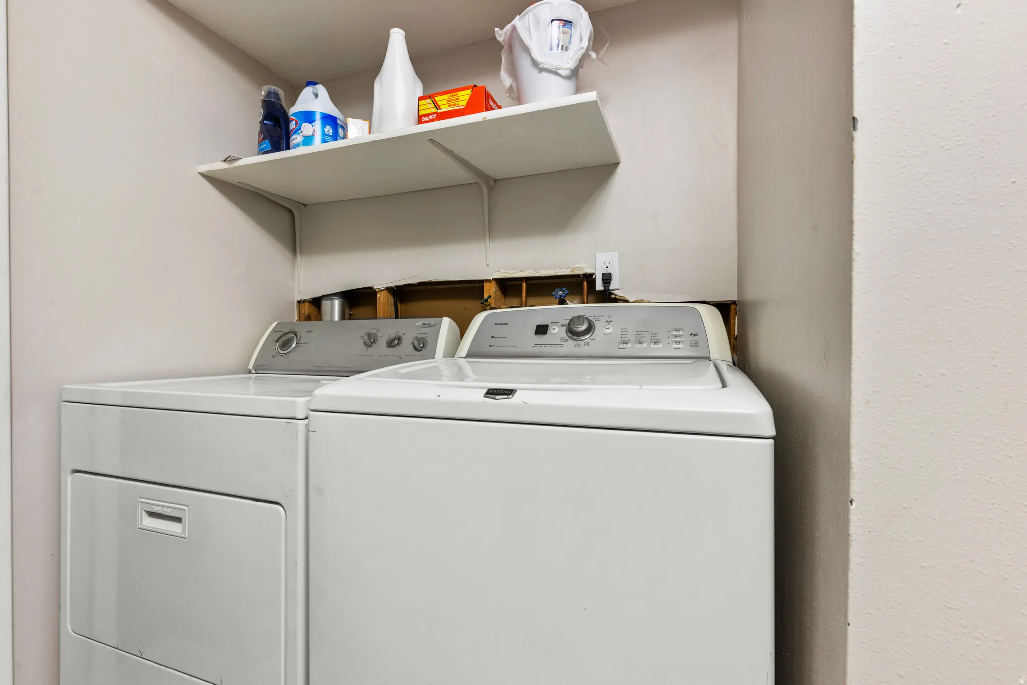 Laundry area with shelving