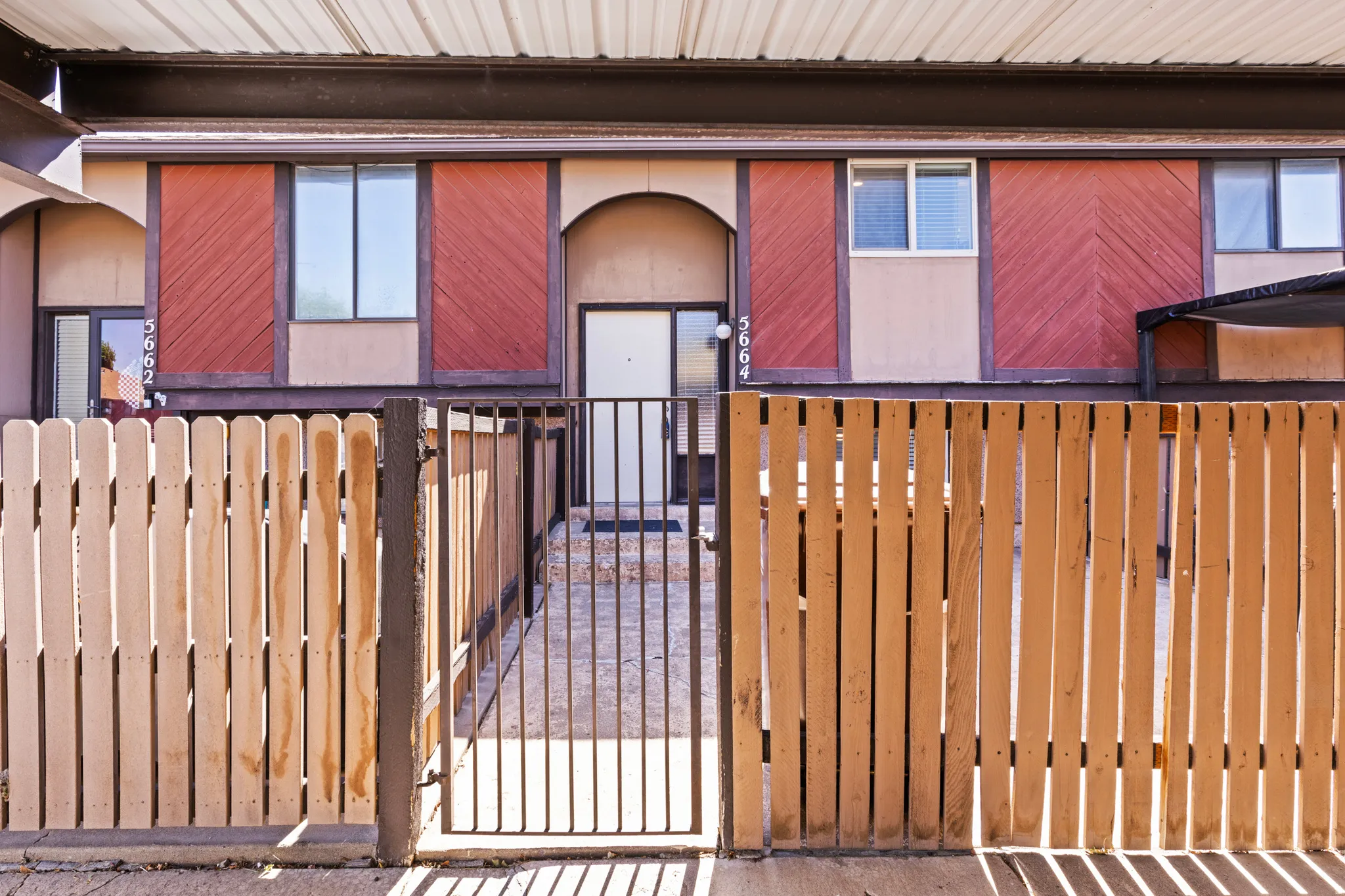 Wood fence enclosing a private courtyard