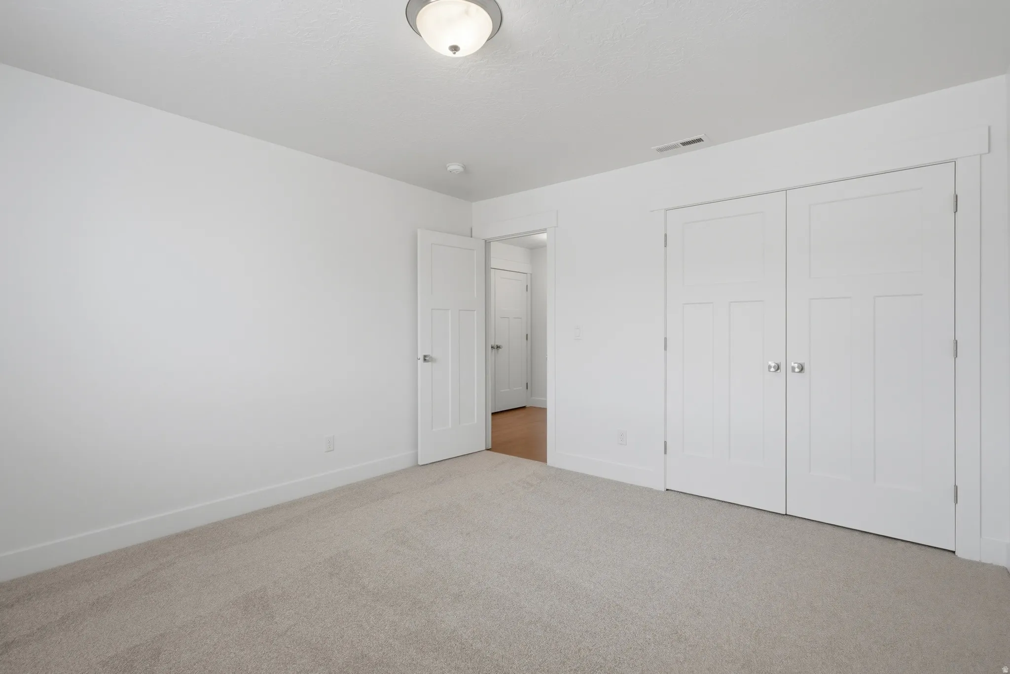 Neutral color palette featuring light beige carpeting