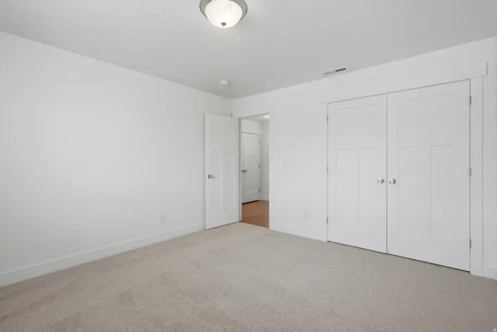 Neutral color palette featuring light beige carpeting