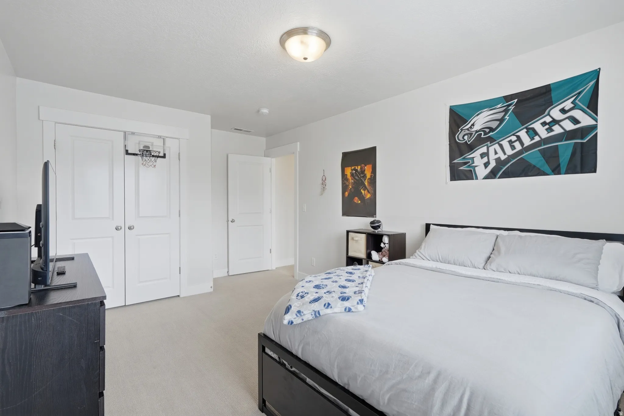 White-painted walls and light-toned carpet create a bright interior