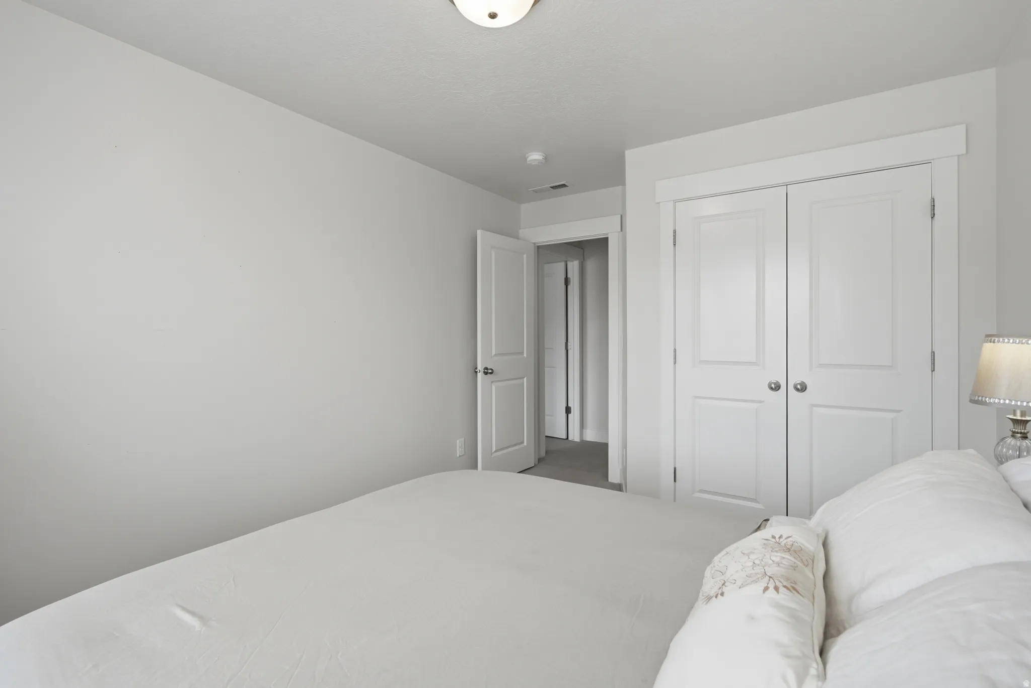 Room featuring light-colored walls and a neutral-toned ceiling