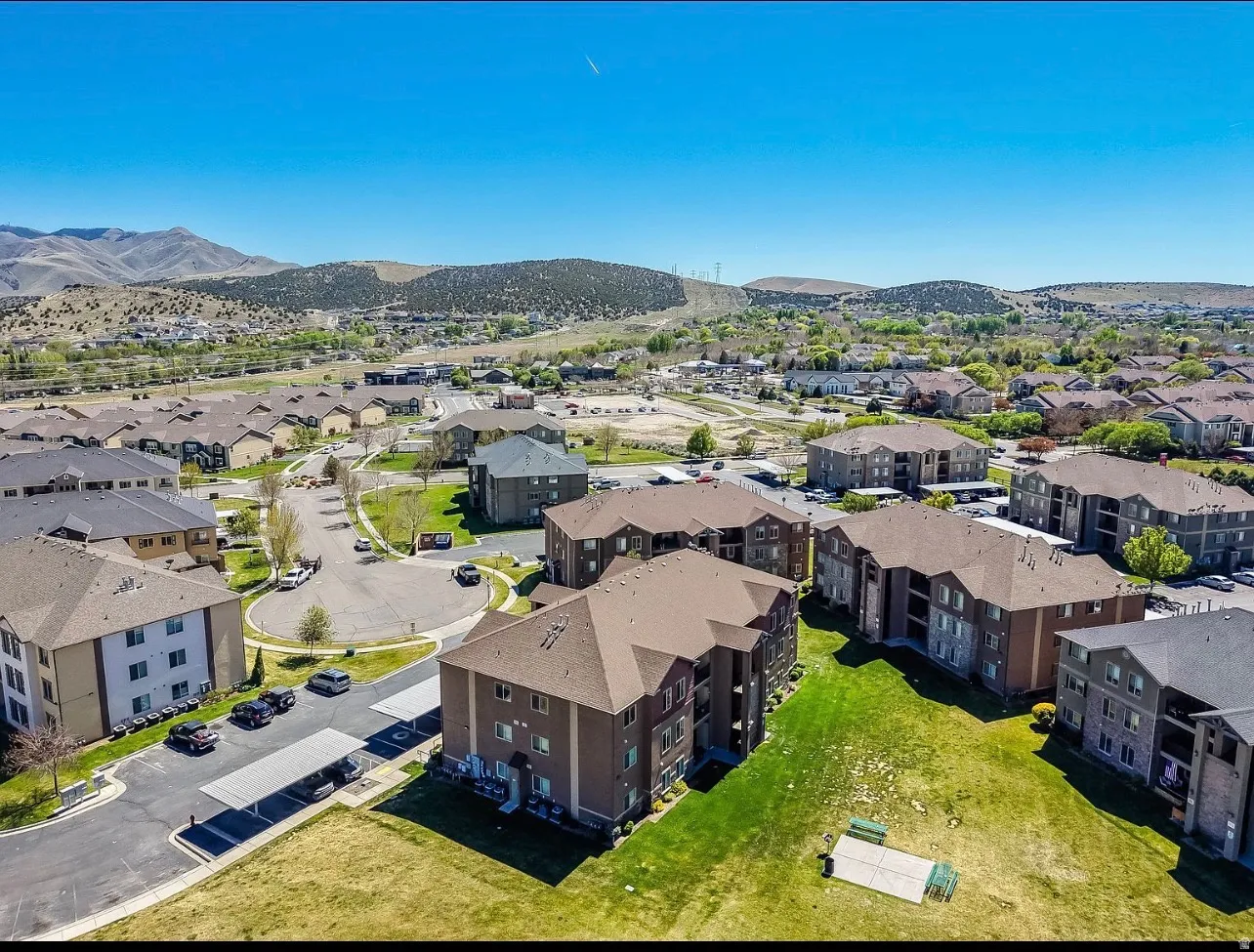 Multi-story residential buildings with brown roofs and light-colored facades