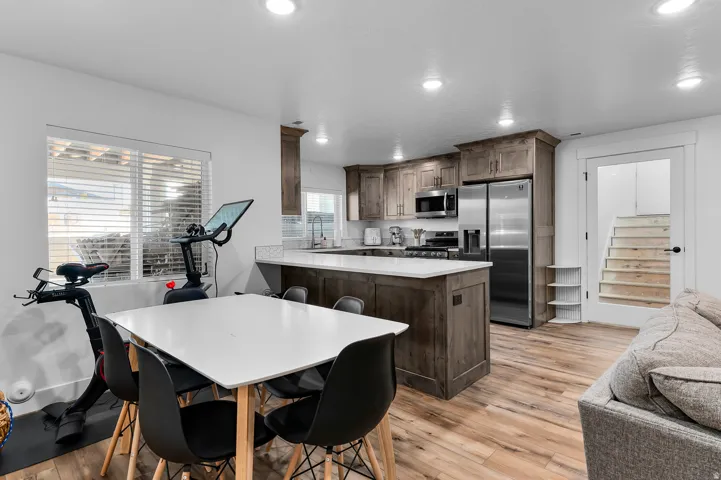 Open-concept living space featuring wood-finish flooring