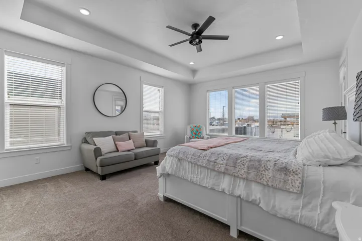 Tray ceiling with recessed lighting and a ceiling fan
