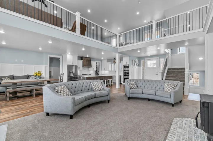 Vaulted ceilings with recessed lighting define this spacious open-concept interior