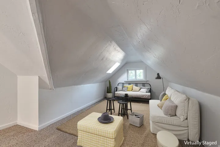 Sloped ceilings, window, skylight, textured walls, carpet flooring